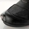 Close-up of the toe area of a black motorcycle boot. Podgląd zdjęcia produktu
