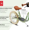 A close-up view of a green balance bike with various features highlighted by text labels. Náhled obrázku produktu