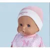 Close-up of a baby doll wearing a pink and white hat and a pink bib. Produktbild-Vorschau