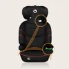 A black car seat with red trim, shown from the front, with orange circles highlighting connection points for a seatbelt. Produktbild-Vorschau