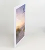 A framed picture of a beach scene with a seagull flying. Produktbild-Vorschau