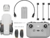 A flat lay of a drone and its accessories, including a remote control, battery, charging cable, propellers, and a small screwdriver. Náhled obrázku produktu