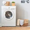 A washing machine with laundry baskets and a plant. Produktbild-Vorschau
