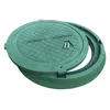 A green manhole cover and its frame are shown on a white background. The cover is slightly ajar, revealing two screws and an Allen key resting on its surface. Podgląd zdjęcia produktu