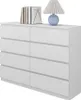 A white dresser with books and a lamp on top, presented on a white background. Voir les images du produit