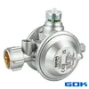 A silver gas regulator with a brass fitting and a clear indicator on top. Produktbild-Vorschau