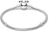 A silver Pandora bracelet with a Mickey Mouse charm is displayed against a white background. Podgląd zdjęcia produktu