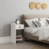 A bedroom scene with a nightstand next to a bed. Podgląd zdjęcia produktu