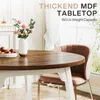 A round dining table with a wooden top and white legs, set in a bright, airy room with a window and curtains. A pink upholstered chair with gold legs is pulled up to the table. A vase of pink roses and a bowl of fruit are on the table. Náhľad obrázku produktu