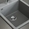 A close-up view of a gray kitchen sink with a chrome faucet and drain. Anteprima dell’immagine prodotto