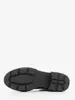 The sole of a black boot is shown against a white background. Voir les images du produit
