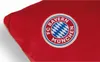 A close-up of a red fabric item with the FC Bayern München logo. Náhľad obrázku produktu