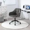 A dark gray office chair is placed on a white rug in a room with a white dresser and a white desk. Produktbild-Vorschau