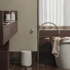 A modern bathroom setting with a bathtub, faucet, and vanity. Produktbild-Vorschau