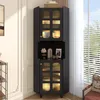 A black corner cabinet with glass doors and LED lighting is shown in a room setting. Anteprima dell’immagine prodotto
