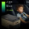 A young boy sleeping in a car seat next to a portable cooler. Anteprima dell’immagine prodotto