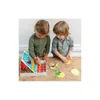 Two young children playing a board game on a wooden table. Podgląd zdjęcia produktu
