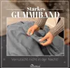 Hands holding a gray fabric, likely a bedsheet, with text overlays and snowflake graphics. Produktbild-Vorschau