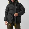 A man wearing a black puffer jacket. Produktbild-Vorschau
