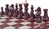 A close-up view of a wooden chess set on a chessboard. Produktbild-Vorschau