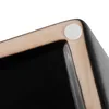 A close-up view of the corner of a black rectangular planter with a tan rim and a white bumper pad on the rim. Náhled obrázku produktu