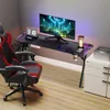 A gaming desk setup with a computer, monitor, keyboard, and gaming chair. Voir les images du produit