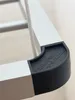 Close-up of a corner of a drying rack with a black protective cap and a white rope. Anteprima dell’immagine prodotto
