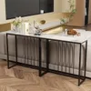 A console table with a marble top and black metal frame is placed behind a sofa in a living room setting. Podgląd zdjęcia produktu