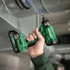 A person is using a cordless impact driver to screw into a metal duct. Anteprima dell’immagine prodotto