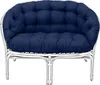 A navy blue cushion set on a white rattan sofa. Produktbild-Vorschau