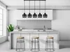 A modern kitchen island with pendant lights and bar stools. Produktbild-Vorschau