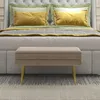 A bedroom scene with a bed and a bench in the foreground. Anteprima dell’immagine prodotto
