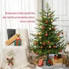 A decorated Christmas tree with presents underneath, next to a chair with gifts on it. Náhled obrázku produktu