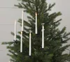 A close-up view of white LED candle string lights attached to a Christmas tree. Podgląd zdjęcia produktu