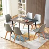 A dining set with a wooden-top table and six chairs in a modern dining room. Voir les images du produit