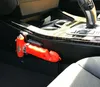 A safety hammer is mounted on the side of a car's center console. Produktbild-Vorschau
