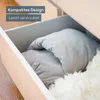 A foot massager is neatly folded and stored in a drawer, next to a fluffy white rug. Anteprima dell’immagine prodotto