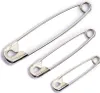 Three safety pins of different sizes arranged diagonally on a white background. Produktbild-Vorschau