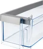 A close-up view of a clear plastic refrigerator door bin with a silver trim. Anteprima dell’immagine prodotto