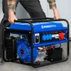 A person is holding a portable generator. Produktbild-Vorschau