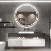 A modern bathroom vanity with a round LED mirror above it. Produktbild-Vorschau