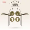 A marketing image showcasing a set of door handles and keyhole escutcheons, presented within an arched doorway graphic. Produktbild-Vorschau
