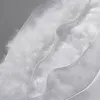 A close-up view of white feathers inside a clear plastic casing, suggesting a pillow filling. Produktbild-Vorschau