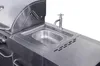 A close-up shot of a stainless steel outdoor kitchen unit, featuring a sink and faucet. Produktbild-Vorschau