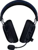 A pair of black gaming headphones with blue stitching on the headband, shown from a front-side angle against a white background. Náhľad obrázku produktu