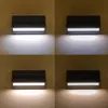 Four images of the same black outdoor wall light, each showing a different light color or intensity. Produktbild-Vorschau