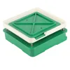 A capsule filling tool with a green base and a white and green top. Voir les images du produit
