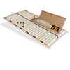 A wooden slatted bed base is shown laid out on a white background, with a cardboard box containing assembly parts placed on top of it. Produktbild-Vorschau