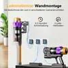 A cordless vacuum cleaner is shown mounted on a wall charging station, with additional charging accessories and a second vacuum cleaner body on a shelf below. Produktbild-Vorschau