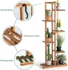 A wooden plant stand with multiple shelves, displaying various potted plants. Náhled obrázku produktu